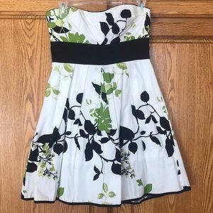 Strapless white dress with green & black flowers w/  black bow. Size 5 (juniors)